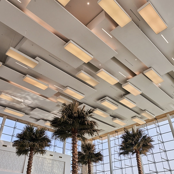 view of ceiling with square light fixtures and palm trees