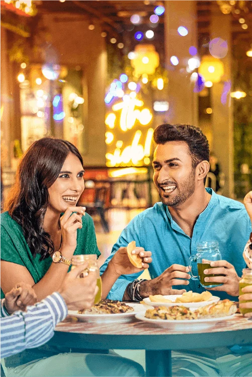 Man and woman enjoying a meal at a restaurant